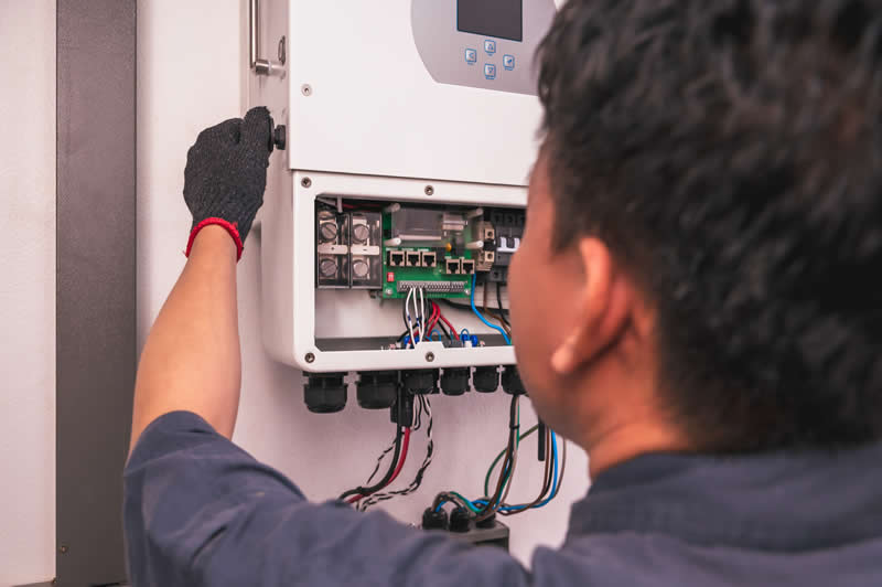 A Solar Engineer working on hybrid solar inverter.
